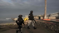 Mexico's National Guard officers, part of the Operation Frontera Norte, stand guard next to the Mexico-US border wall in Playas de Tijuana, Baja California state, Mexico on February 5, 2025. (Photo by Guillermo Arias / AFP)
