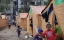 Displaced Palestinian families take refuge in tents installed near their damaged homes in Jabalia in the northern Gaza Strip on February 6, 2025. Photo by Bashar TALEB / AFP