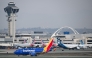 Photo used for representational purposes. A Southwest Airlines Boeing 737-700 airplane taxis past American Airlines and Alaska Airlines airplanes at Los Angeles International Airport (LAX) in Los Angeles, California on January 31, 2025. Photo by Patrick T. Fallon / AFP.
