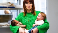 (Files) Co-Owner and Commercial Director of Cinebebe and Studio Junon Justine Ray Le Solliec poses with fake babies created by Cinebebe (Cinebaby) in Saint-Denis, suburbs of Paris, on January 24, 2025. (Photo by Julie Sebadelha / AFP)