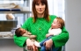 (Files) Co-Owner and Commercial Director of Cinebebe and Studio Junon Justine Ray Le Solliec poses with fake babies created by Cinebebe (Cinebaby) in Saint-Denis, suburbs of Paris, on January 24, 2025. (Photo by Julie Sebadelha / AFP)