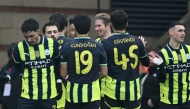 Manchester City's Belgian midfielder #17 Kevin De Bruyne (C) celebrates with teammates after scoring their second goal during the English FA Cup fourth round football match between Leyton Orient and Manchester City at Gaughan Group Stadium, Brisbane Road in east London on February 8, 2025. (Photo by JUSTIN TALLIS / AFP) 