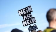 Participants display placards against the Alternative for Germany (AfD) party during a rally against the far right at the Theresienwiese in Munich, southern Germany, on February 8, 2025, almost two weeks ahead of parliamentary elections. (Photo by LUKAS BARTH-TUTTAS / AFP)
