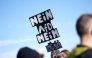 Participants display placards against the Alternative for Germany (AfD) party during a rally against the far right at the Theresienwiese in Munich, southern Germany, on February 8, 2025, almost two weeks ahead of parliamentary elections. (Photo by LUKAS BARTH-TUTTAS / AFP)
