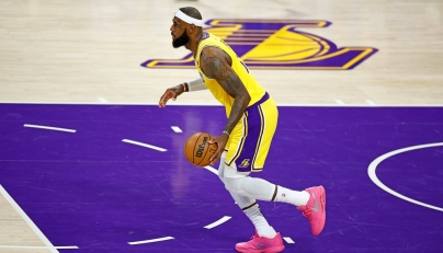 LeBron James #6 of the Los Angeles Lakers handles the ball during the first half of a game against the Oklahoma City Thunder at Crypto.com Arena on February 07, 2023 in Los Angeles, California. Ronald Martinez/Getty Images/AFP

