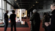 A general view shows the exhibitors' lounge during a cultural weekend in conjunction with the Summit for Action on Artificial Intelligence at the BNF (Bibliothèque natvionale François Miterrand) in Paris, on February 8, 2025. (Photo by Thibaud MORITZ / AFP)