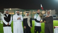 Minister of Awqaf and Islamic Affairs H E Ghanim bin Shaheen Al Ghanim honouring the winning team.