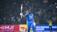 India's captain Rohit Sharma celebrates after scoring a century (100 runs) during the second one-day international (ODI) cricket match between India and England at the Barabati Stadium in Cuttack on February 9, 2025. (Photo by Dibyangshu Sarkar / AFP)