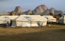 Representational file photo. People already displaced by conflict, rest by tents at a makeshift campsite they were evacuated to following deadly floods in the eastern city of Kassala on August 11, 2024. (Photo by AFP)

