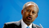 Sudan's Prime Minister Abdalla Hamdok and German Chancellor Angela Merkel (not pictured) address the media at the Chancellery in Berlin, Germany, February 14, 2020. REUTERS/Hannibal Hanschke/File Photo