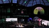 France's President Emmanuel Macron (centre) delivers a speech during a closing event for the first day of the Artificial Intelligence (AI) Action Summit, at the Grand Palais, in Paris, on February 10, 2025. (Photo by Joel Saget / AFP)
