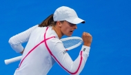 Iga Swiatek of Poland reacts after scoring a point against Maria Sakkari of Greece. AFP