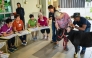 A senior participants interacts with a therapy miniature horse during the launch of Singapore's first equine-assisted program at NTUC Health Active Ageing Centre in Singapore on February 11, 2025. (Photo by Roslan RAHMAN / AFP)