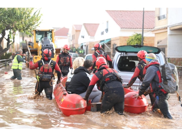 File: This handout photo taken by the UME-Spanish Military Emergencies Unit shows Spanish rescuers taking residents on a dinghy boat following deadly flooding, in Valencia, on October 30, 2024. (Photo by Handout / UME / AFP)