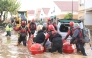 File: This handout photo taken by the UME-Spanish Military Emergencies Unit shows Spanish rescuers taking residents on a dinghy boat following deadly flooding, in Valencia, on October 30, 2024. (Photo by Handout / UME / AFP)