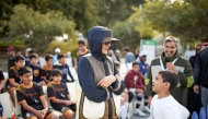 Chairperson of Qatar Foundation H H Sheikha Moza bint Nasser interacting with a child during National Sport Day (NSD) activities held yesterday in Education City. 