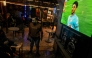 Men watch UEFA Champions League match Manchester City against Real Madrid, at a cafe in Cairo on February 11, 2025. (Photo by Khaled Desouki / AFP)