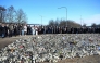 People gather at a makeshift memorial to observe a national minute's silence to honor the victims of the February 4 school shooting in Orebro, Sweden on February 11, 2025. (Photo by Jessica GOW / TT News Agency / AFP) / Sweden OUT
