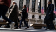 People walk by Wall Street on February 04, 2025 in New York City. (Photo by SPENCER PLATT / GETTY IMAGES NORTH AMERICA / Getty Images via AFP)
