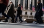 People walk by Wall Street on February 04, 2025 in New York City. (Photo by SPENCER PLATT / GETTY IMAGES NORTH AMERICA / Getty Images via AFP)
