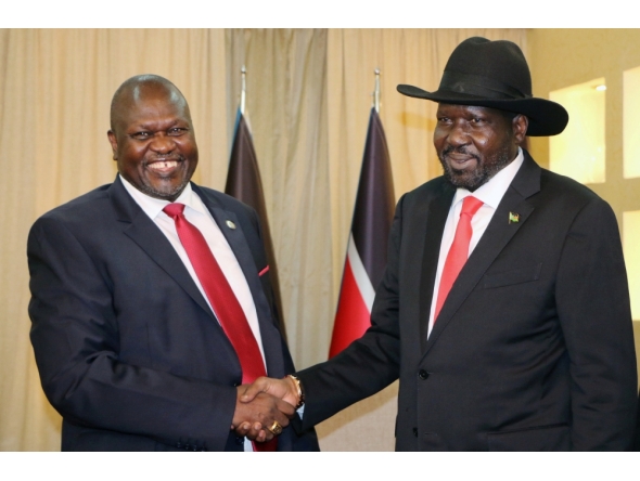 FILE PHOTO: South Sudan's President Salva Kiir shakes hands with ex-vice president and former rebel leader Riek Machar during their meeting in Juba, South Sudan, October 19, 2019. REUTERS/Jok Solomun/File Photo