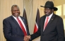 FILE PHOTO: South Sudan's President Salva Kiir shakes hands with ex-vice president and former rebel leader Riek Machar during their meeting in Juba, South Sudan, October 19, 2019. REUTERS/Jok Solomun/File Photo