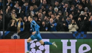 Club Brugge's Swedish forward #19 Gustaf Nilsson celebrates scoring his team's second goal during the UEFA Champions League knockout phase play-off 1st leg football match between Club Brugge KV and Atalanta at the Jan-Breydel stadium in Sint-Andries, Bruges, on February 12, 2025. (Photo by NICOLAS TUCAT / AFP)
