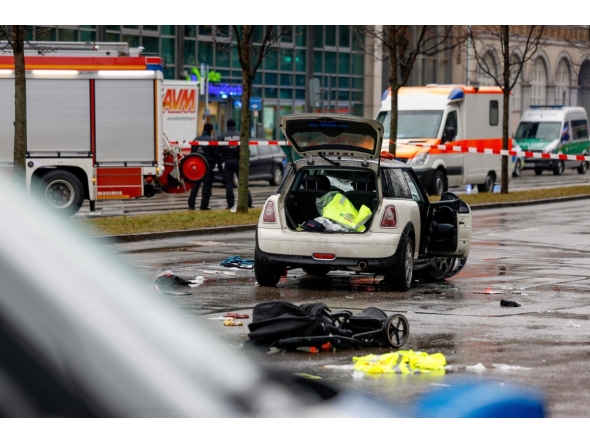 Members of the emergency services work at the scene where a car drove into a crowd in the southern German city of Munich on February 13, 2025 leaving several people injured, police said. Photo by Michaela STACHE / AFP