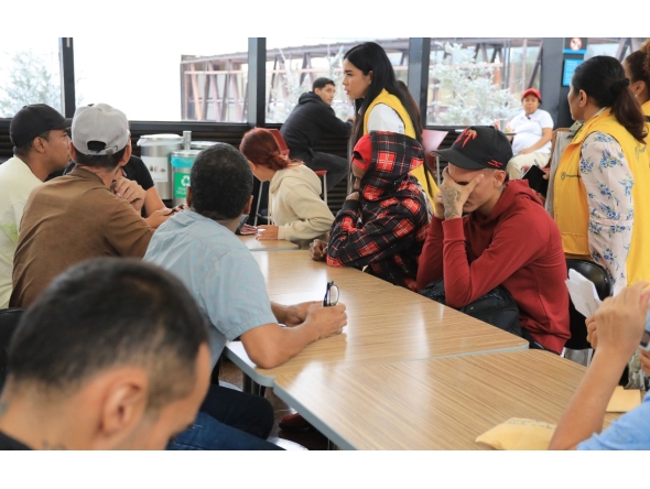 Colombian migrants deported from Panama are received by members of the Social Prosperity Department upon arrival at the Jose Maria Cordova International Airport in Rionegro, Antioquia department, Colombia, on February 13, 2025. (Photo by JAIME SALDARRIAGA / AFP)
