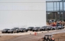 (FILES) Newly manufactured Tesla Cybertrucks are parked outside the company's Giga Texas factory on December 13, 2023, in Austin, Texas. (Photo by SUZANNE CORDEIRO / AFP)
