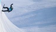 Afghanistan's Ahmad Habibzi competes in the men's snowboard halfpipe qualification during the Harbin 2025 Asian Winter Games in Yabuli, Northeast China's Heilongjian province on February 12, 2025. (Photo by Hector Retamal / AFP)