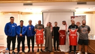 Representatives of participating nations pose with their team jerseys. 