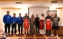 Representatives of participating nations pose with their team jerseys. 