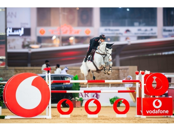 Italy's Emanuele Gaudiano astride grey gelding Chalou's Love PS clears a rail.