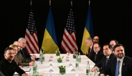 US Vice President JD Vance (R), US Secretary of State Marco Rubio (2nd R) and Ukrainian President Volodymyr Zelensky (L) meet on the sidelines of the 61st Munich Security Conference (MSC) in Munich, southern Germany on February 14, 2025. (Photo by Tobias Schwarz / AFP)