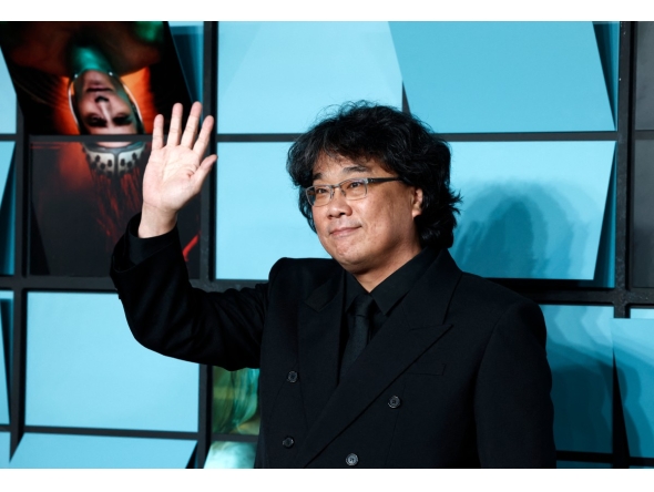 South Korean director Bong Joon Ho poses upon arrival for the World premiere of the film 