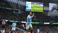 Manchester City's Egyptian striker #07 Omar Marmoush (C) celebrates after scoring his and City's third goal during the English Premier League football match between Manchester City and Newcastle United at the Etihad Stadium in Manchester, north west England, on February 15, 2025. (Photo by Oli SCARFF / AFP)