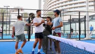 Qatar Tennis Federation President Nasser Al Khelaifi and Novak Djokovic shake hands following their friendly padel match yesterday.