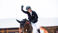 Germany’s Janne F. Meyer-Zimmermann celebrates her victory with Messi Van ‘T Ruytershof.