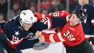 Matthew Tkachuk #19 of Team USA fights with Brandon Hagel #38 of Team Canada during the first period in the 4 Nations Face-Off game at the Bell Centre on February 15, 2025 in Montreal, Quebec, Canada. Minas Panagiotakis/Getty Images/AFP 