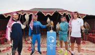 Grigor Dimitrov, Novak Djokovic, Carlos Alcaraz and Stefanos Tsitsipas pose for a photo with the Golden Falcon Trophy ahead of the Qatar ExxonMobil Open yesterday.