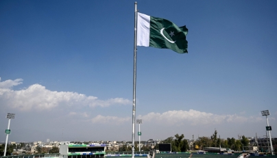 Pakistan's national flag flutters at the Rawalpindi Cricket Stadium ahead of the ICC Men's Champions Trophy one-day international (ODI) cricket matches in Rawalpindi on February 17, 2025. (Photo by Aamir Qureshi / AFP)