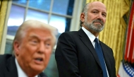 (FILES) US President Donald Trump speaks to the press after signing an executive order, alongside US Secretary of Commerce nominee Howard Lutnick (R), in the Oval Office of the White House in Washington, DC, on February 10, 2025. (Photo by ANDREW CABALLERO-REYNOLDS / AFP)
