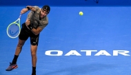 Italy’s Matteo Berettin serves against Serbia’s Novak Djokovic. AFP