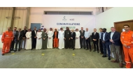 QatarEnergy LNG and Milaha officials pose for a group photo.