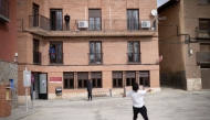 Refugees play with a ball in front of Accem association's residence, in Burbaguena, near Teruel, on February 10, 2025. (Photo by Josep LAGO / AFP)
 