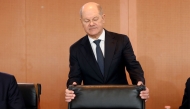 German Chancellor Olaf Scholz holds his chair as he arrives for the weekly meeting of the German cabinet at the Chancellery in Berlin on February 19, 2025. (Photo by Odd ANDERSEN / AFP)