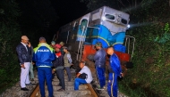 Police and railway personnel examine a derailed train at Habarana in eastern Sri Lanka on February 20, 2025, which killed six elephants. (Photo by AFP)