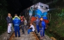 Police and railway personnel examine a derailed train at Habarana in eastern Sri Lanka on February 20, 2025, which killed six elephants. (Photo by AFP)