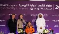 From left: German rider Marcus Ehning and Dutch riders Dinja van Liere and Rext van der Hulst pose with Event Director Mohammed Jaber Al Khayarin after the pre-event press conference.